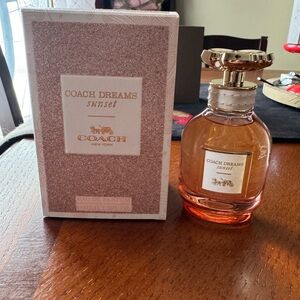 Coach Dreams Sunset Perfume with Pink and Gold Accents